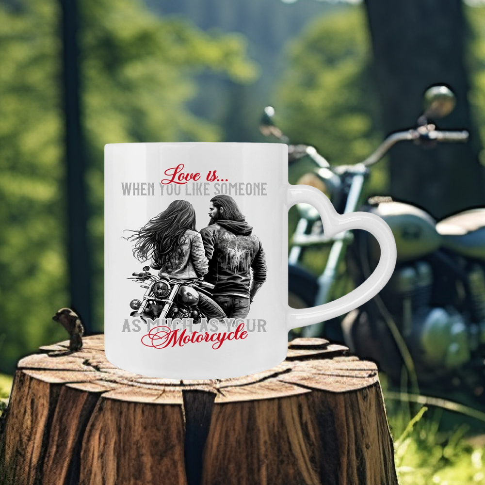 Eine Tasse für Motorradfahrer von Wingbikers, mit dem beidseitigen Aufdruck, Love is, when you love someone as much as your motorcycle, in weiß, mit Herzchenhenkel.