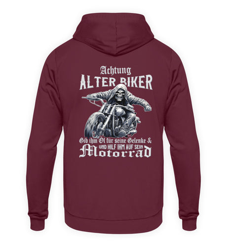 Ein Biker Hoodie für Motorradfahrer von Wingbikers mit dem Aufdruck, Achtung alter Biker - Gib ihm Öl und hilf ihm auf sein Motorrad, als Back Print - in burgunder weinrot.