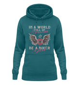 Ein Damen Hoodie für Motorradfahrerinnen von Wingbikers mit dem Aufdruck, In A World Full Of Princesses - Be A Biker Girl, in petrol türkis.