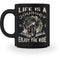 Eine Tasse für Motorradfahrer von Wingbikers, mit dem beidseitigen Aufdruck, Life Is A Journey - Enjoy The Ride, in schwarz.