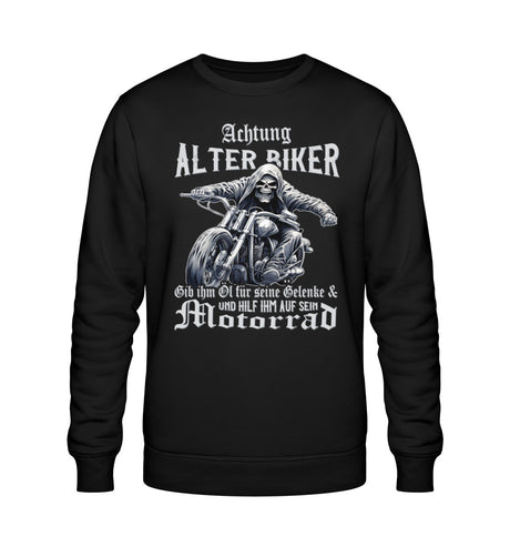 Ein Biker Sweatshirt für Motorradfahrer von Wingbikers mit dem Aufdruck, Achtung alter Biker - Gib ihm Öl und hilf ihm auf sein Motorrad - in schwarz.