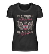 Ein T-Shirt für Motorradfahrerinnen von Wingbikers mit dem Aufdruck, In A World Full Of Princesses - Be A Biker Girl, in schwarz.