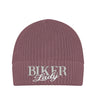 Eine Bikerin Beanie Mütze für Motorradfahrerinnen von Wingbikers mit dem Stick, Biker Lady, in alt rosa.