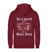 Ein Bikerin Zip-Hoodie für Motorradfahrerinnen von Wingbikers mit dem Aufdruck, In a world full of Princesses, be a Biker Bitch - in burgunder weinrot.