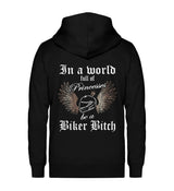 Ein Bikerin Zip-Hoodie für Motorradfahrerinnen von Wingbikers mit dem Aufdruck, In a world full of Princesses, be a Biker Bitch - in schwarz.