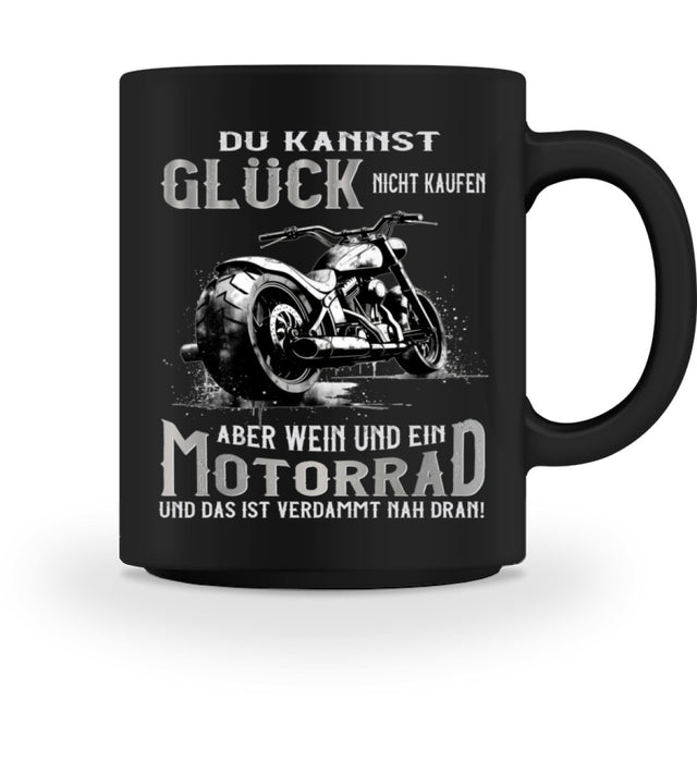 Eine Biker Tasse für Motorradfahrer, von Wingbikers, mit dem beidseitigen Aufdruck, Du kannst Glück nicht kaufen, aber Wein und ein Motorrad - Das ist verdammt nah dran!, in schwarz.