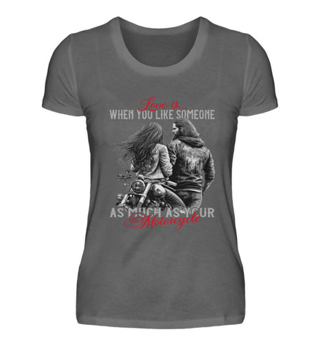 Ein T-Shirt für Motorradfahrerinnen von Wingbikers mit dem Aufdruck, Love is... When You Like Someone As Much As Your Motorcycle, in dunkelgrau.