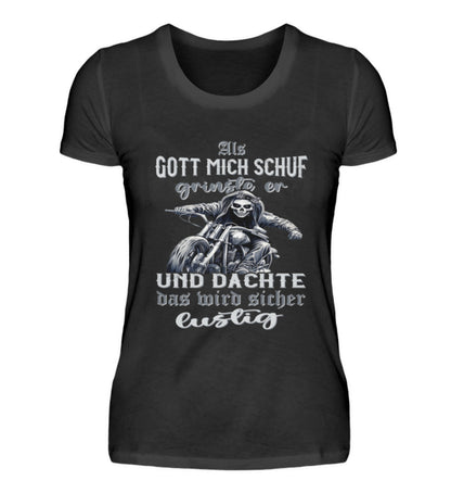 Ein Bikerin T-Shirt für Motorradfahrerinnen von Wingbikers mit dem Aufdruck, Als Gott mich schuf grinste er und dachte, das wird sicher lustig - in schwarz.