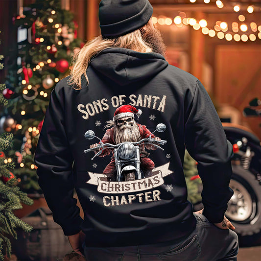 Eine Biker mit einer weihnachtliche Reißverschluss-Jacke für Motorradfahrer von Wingbikers mit dem Aufdruck, Sons of Santa - Christmas Chapter, in schwarz.