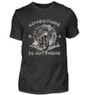 Ein T-Shirt für Motorradfahrer von Wingbikers mit dem Aufdruck, Adventure Is Out There, in schwarz.