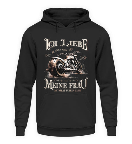 Ein Biker Hoodie für Motorradfahrer von Wingbikers mit dem Aufdruck, Ich liebe meine Frau, wenn sie mich Motorrad fahren lässt! - in schwarz.