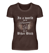 Ein Bikerin T-Shirt für Motorradfahrerinnen von Wingbikers mit dem Aufdruck, In a world full of Princesses, be a Biker Bitch - in braun.