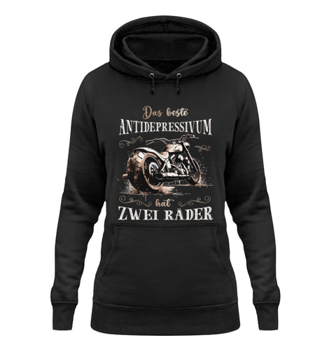 Ein Damen Hoodie für Motorradfahrerinnen von Wingbikers mit dem Aufdruck, Das beste Antidepressivum hat zwei Räder, in schwarz.