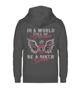 Eine Reißverschluss-Jacke für Motorradfahrerinnen von Wingbikers mit dem Aufdruck, In A World Full Of Princesses - Be A Biker Girl, in dunkelgrau.