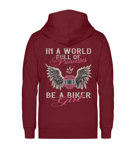 Eine Reißverschluss-Jacke für Motorradfahrerinnen von Wingbikers mit dem Aufdruck, In A World Full Of Princesses - Be A Biker Girl, in burgunder weinrot.