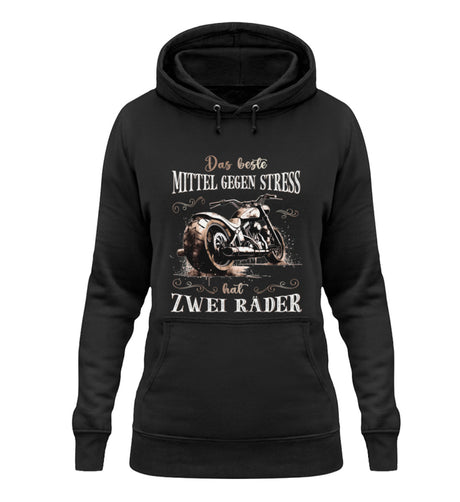 Ein Damen Hoodie von Wingbikers für Motorradfahrerinnen mit dem Aufdruck, Das beste Mittel gegen Stress hat 2 Räder, in schwarz.