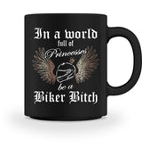 Eine Tasse für Motorradfahrerinnen von Wingbikers, mit dem beidseitigen Aufdruck, In a world full of Princesses, be a Biker Bitch, in schwarz.